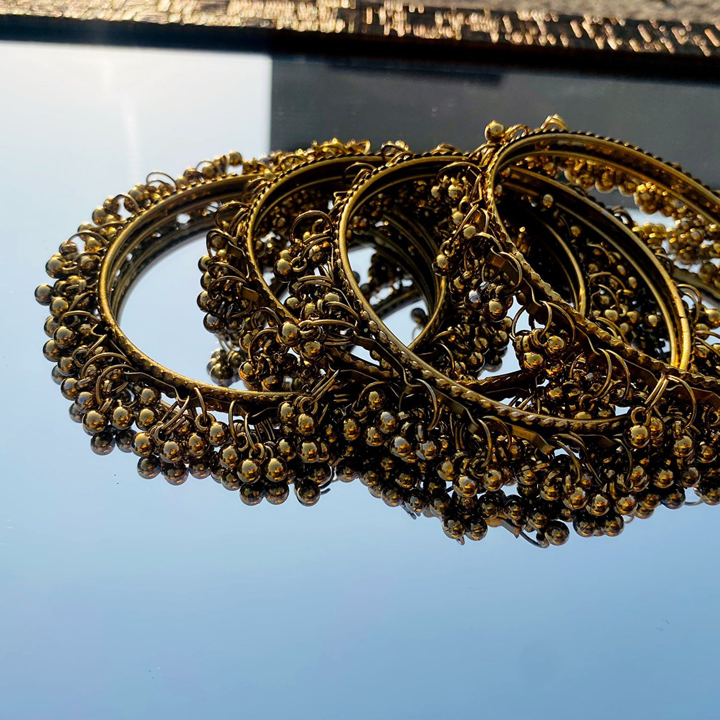 A stunning set of traditional ghungroo bangles, designed to offer both visual elegance and rhythmic charm.