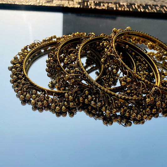 A stunning set of traditional ghungroo bangles, designed to offer both visual elegance and rhythmic charm.
