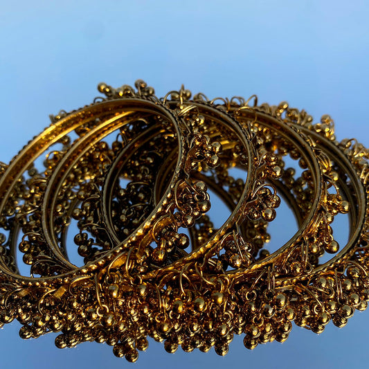 A stunning set of traditional ghungroo bangles, designed to offer both visual elegance and rhythmic charm.